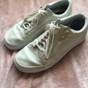 Cream colored vans with gold zipper